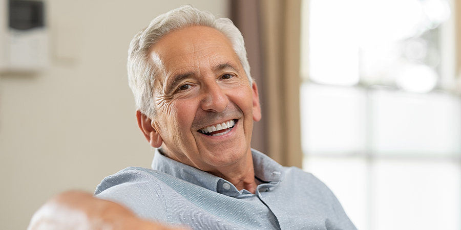 Smiling Older Male with Traditional Dentures