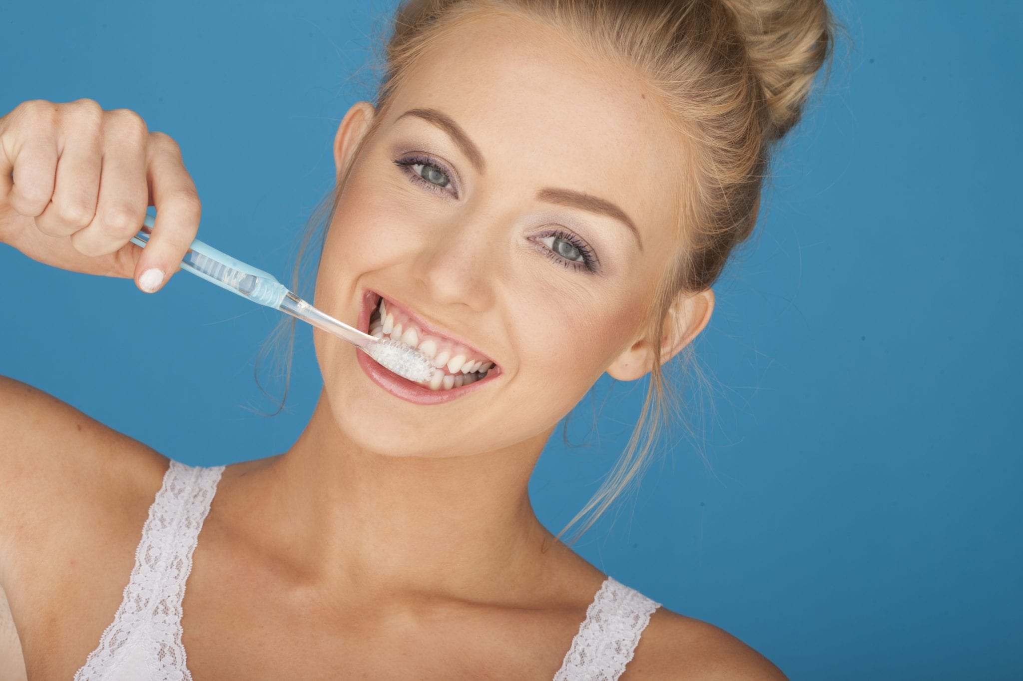 Blond Model Brushing Teeth Copy