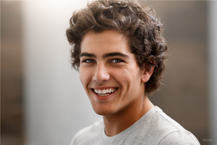 Young Male Model With Curly Brown Hair