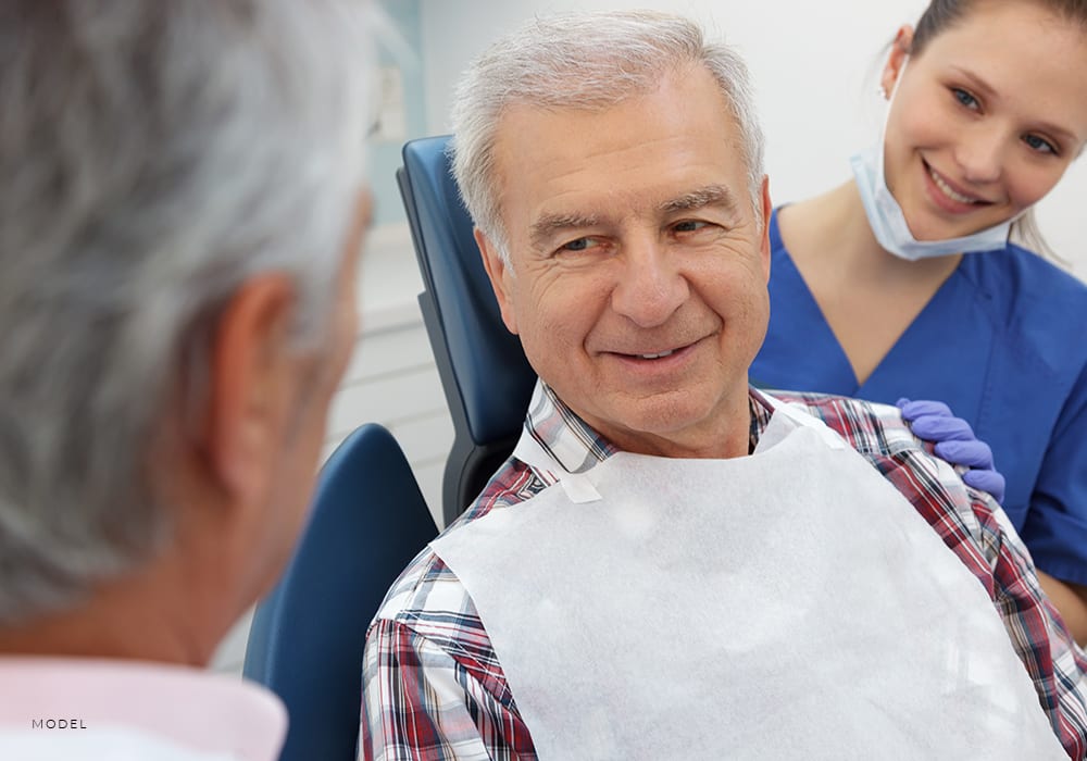 Patient Discussing Hygiene Tips After Oral Surgery With Dentist