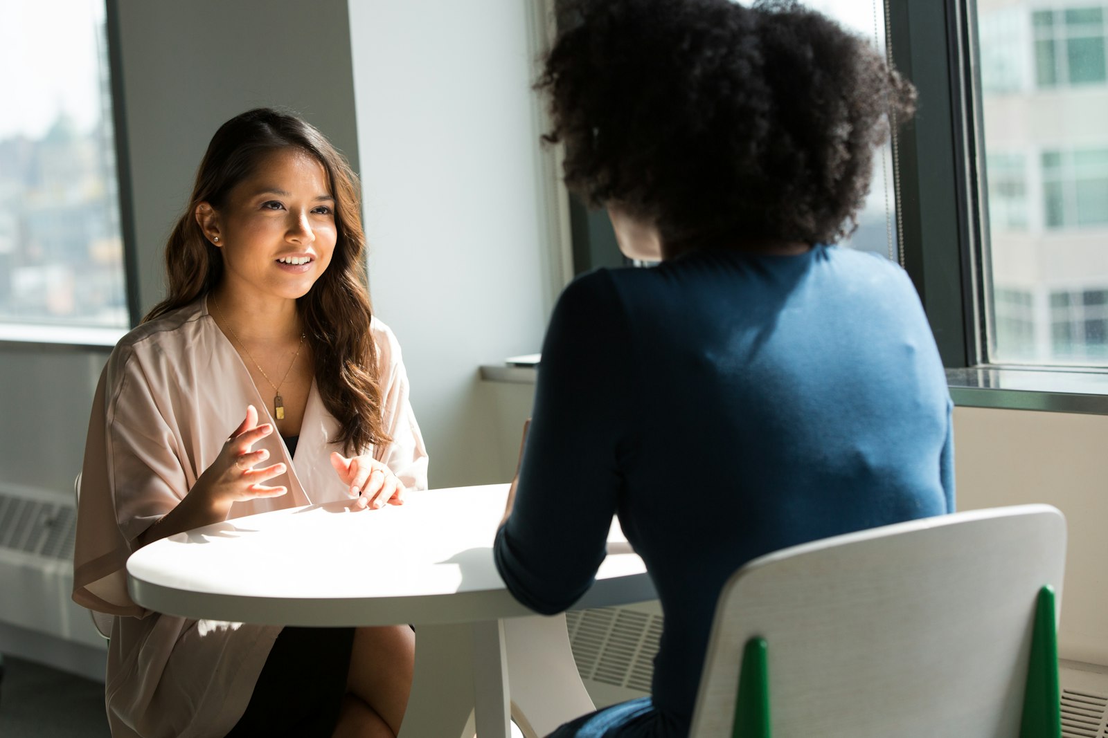 Two people in a warm, unhurried conversation about dental treatment