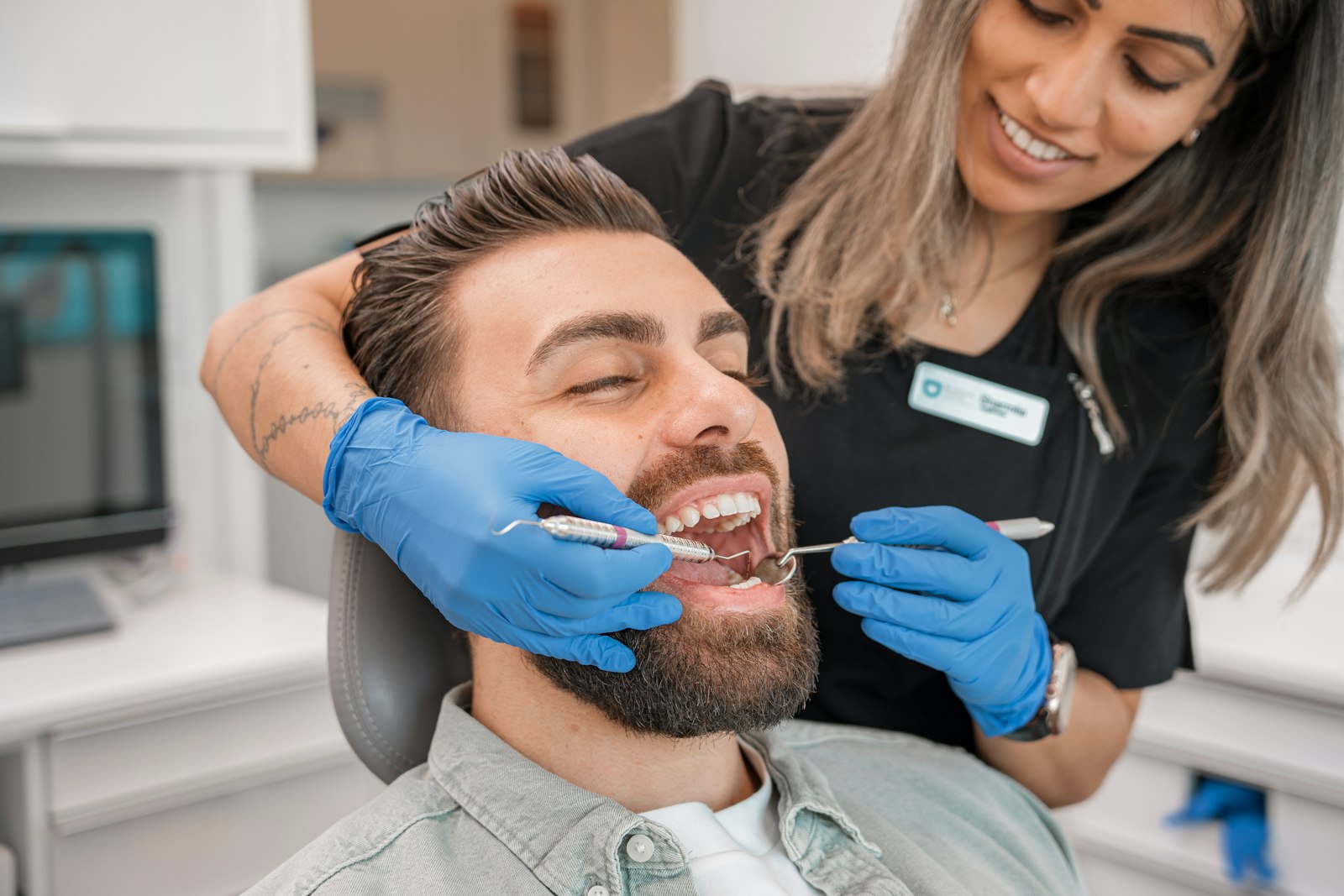 Prosthodontist evaluating a patient with difficulty chewing in Belmont MA