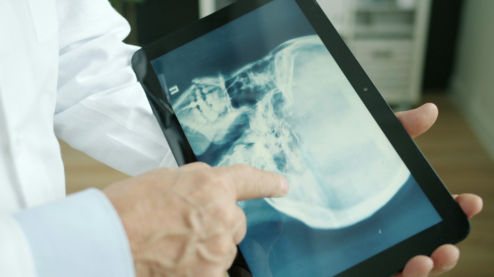 Dentist reviewing a 3D digital plan for guided implant placement in Cambridge MA