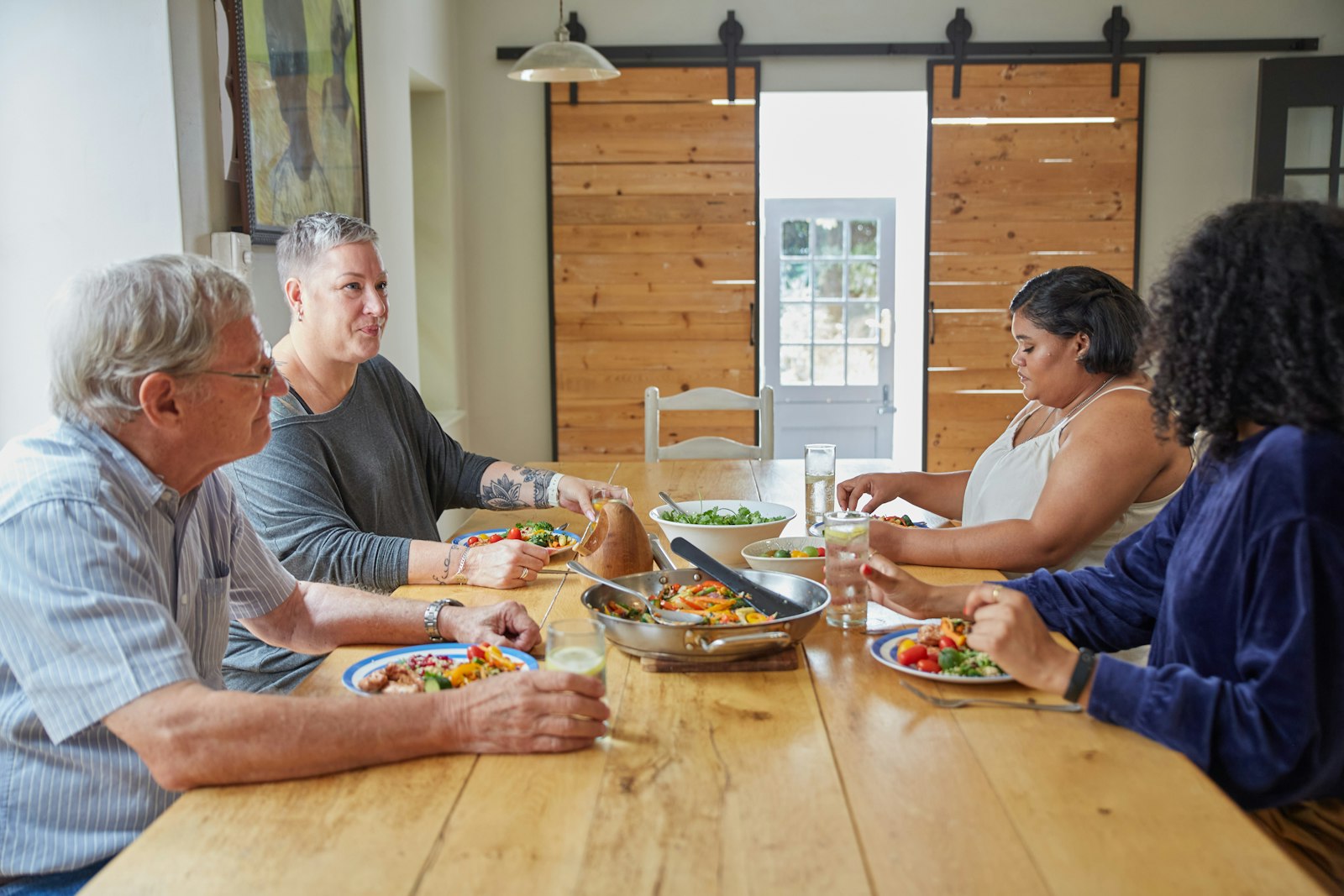 Sharing a meal with confidence after full-arch implant treatment in Belmont MA