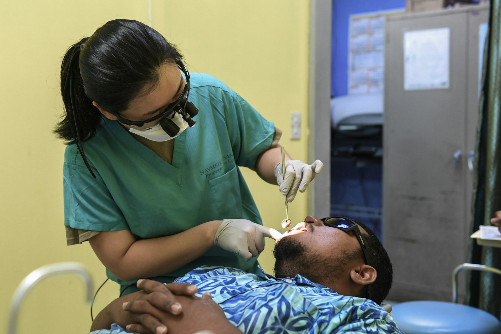 Dentist providing gentle, unhurried care to a nervous patient in Belmont MA