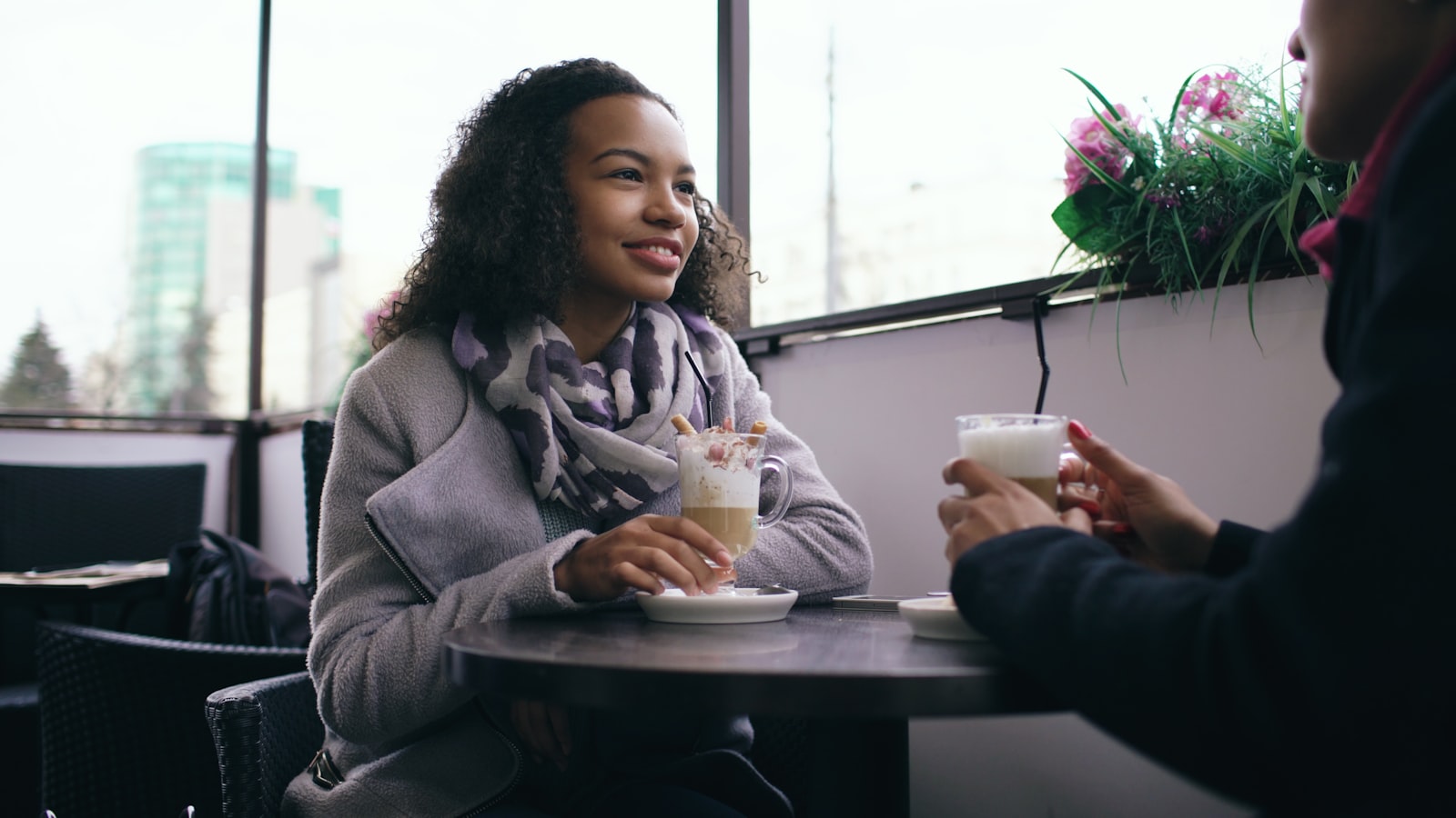 Patient and clinician in an unhurried, comfortable conversation about treatment
