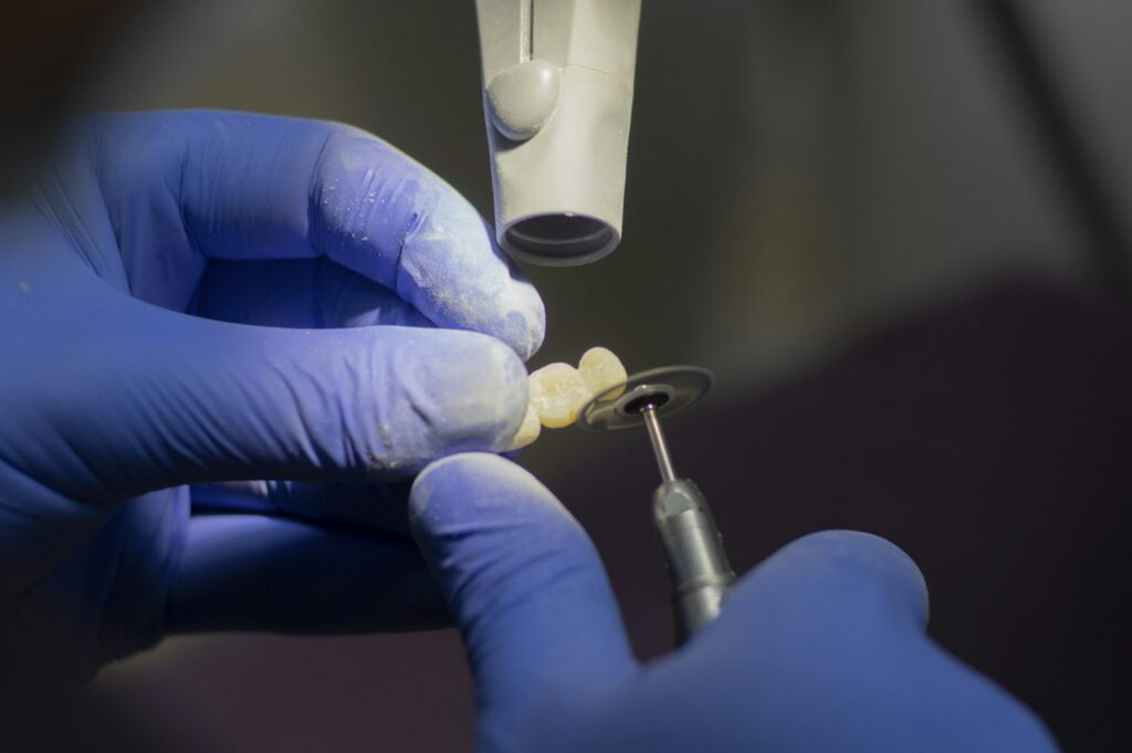 A prosthodontist performing precise restorative work in Belmont MA
