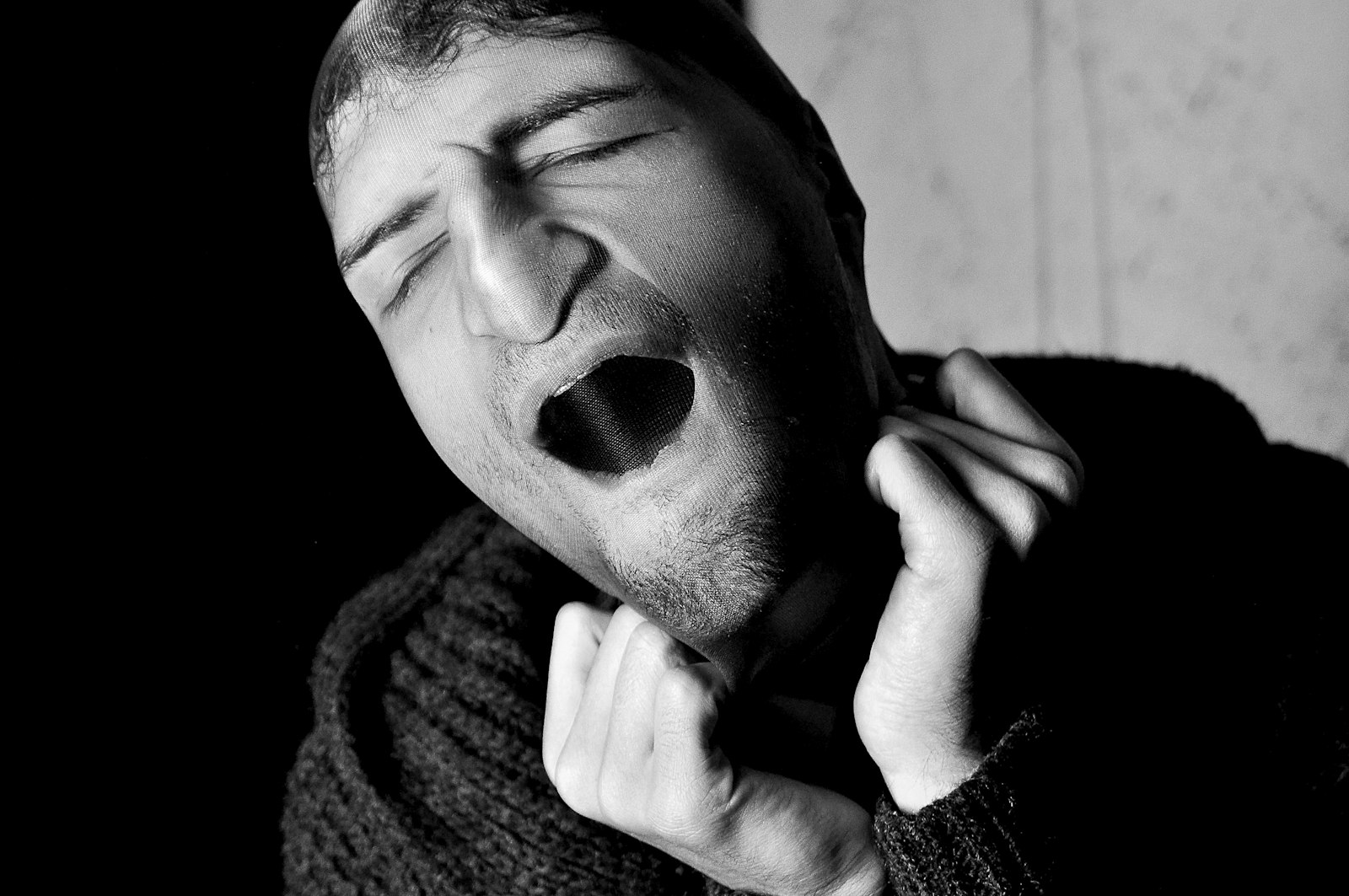 Person waking with jaw tension and headache from nighttime grinding