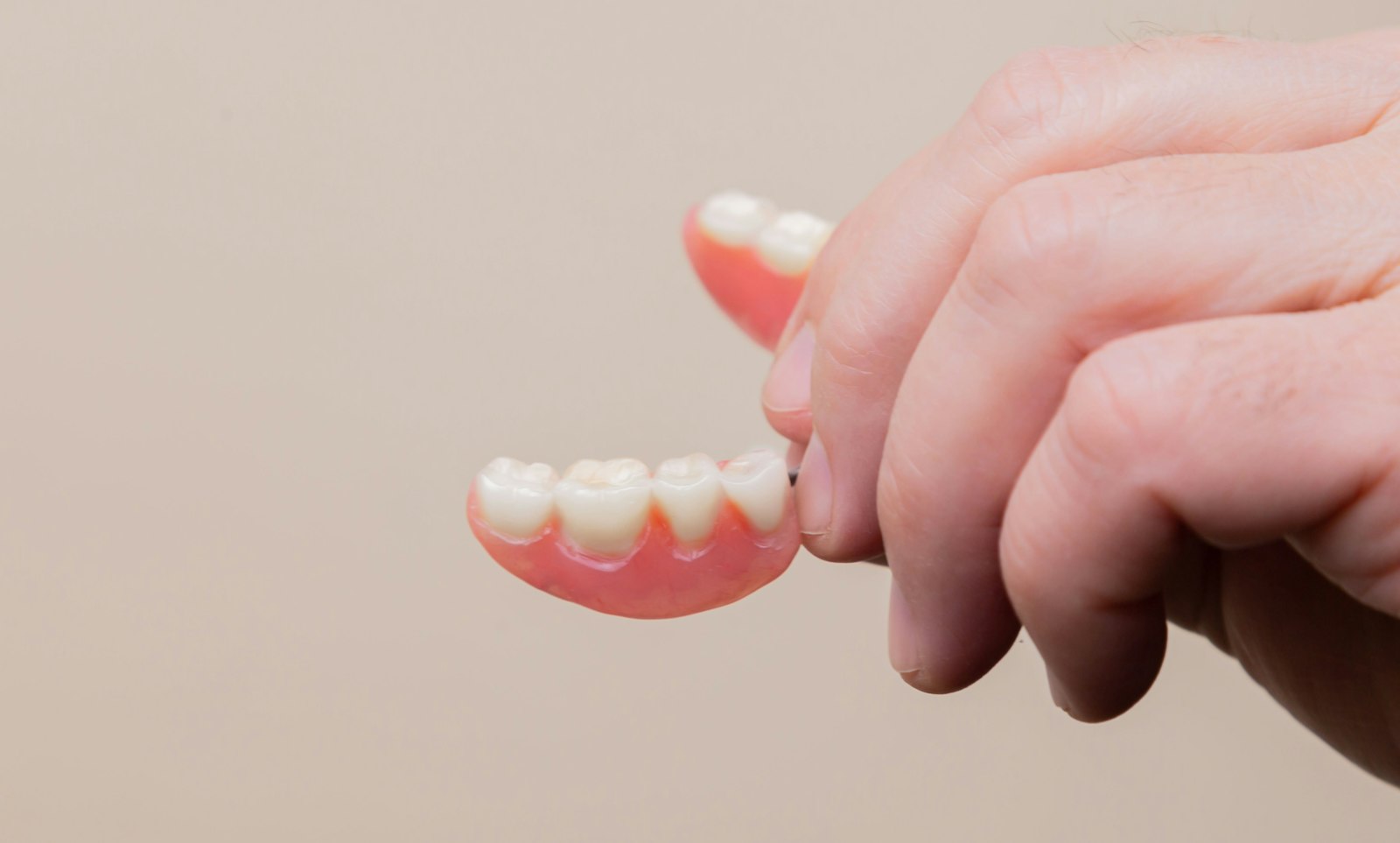 A traditional full denture that rests on the gums in Belmont MA