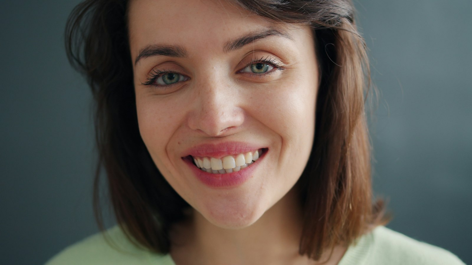 A bright, natural smile achieved with cosmetic dental treatment in Belmont MA